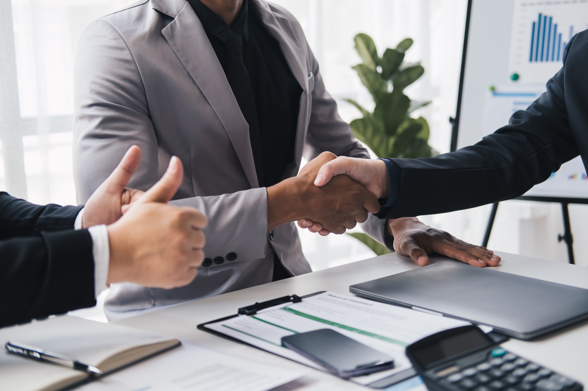 Cropped shot of professional business people having a hand shake after the meeting is over with